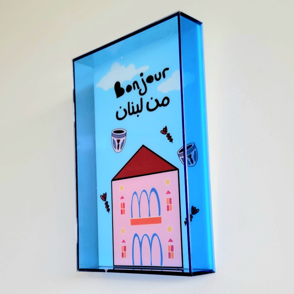 Decorative wall art with a lebanese building and blue sky