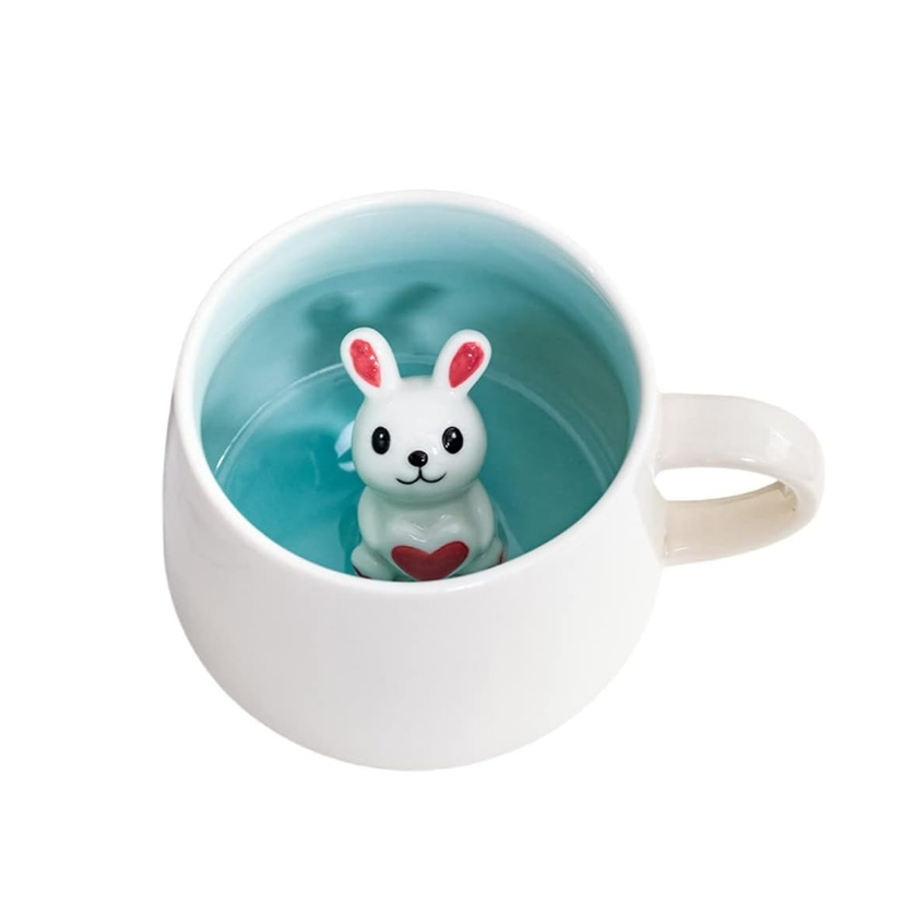 White ceramic mug with a small rabbit figurine inside