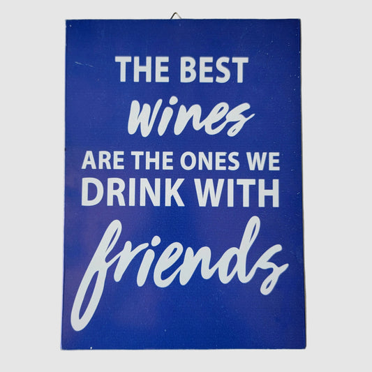  blue wall sign with white text that reads, 'THE BEST wines ARE THE ONES WE DRINK WITH friends,' 
