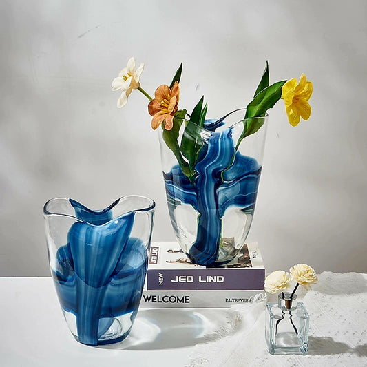 Two blue marbled vases with flowers 