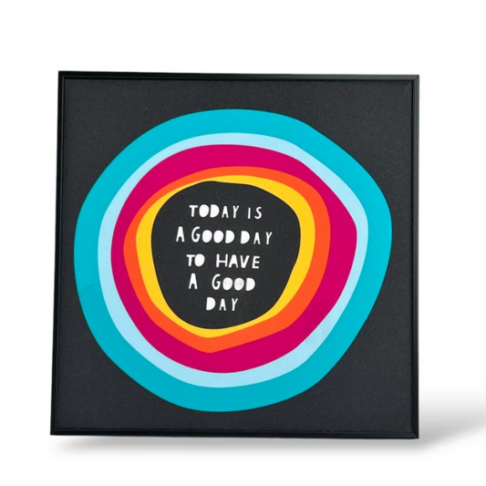 Decorative wall art with colorful concentric circles and text on a black background, featuring the brand 'Share Yalla'.