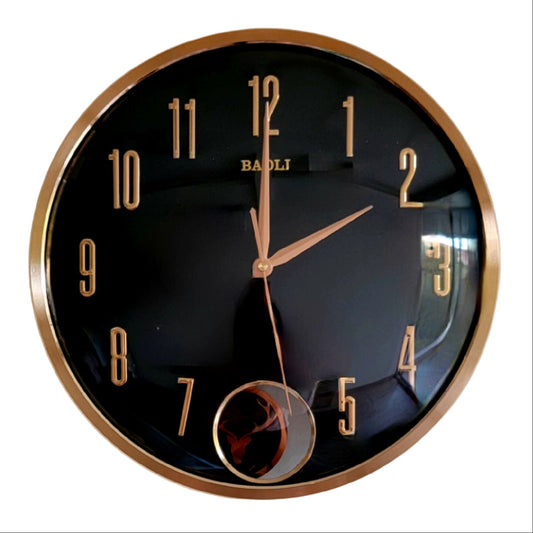 Round wall clock with black face and gold frame